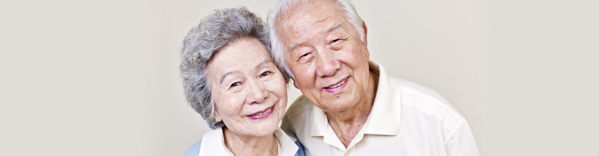 elderly couple hugging each other