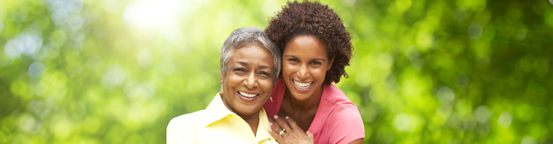 elder woman with caregiver outdoors