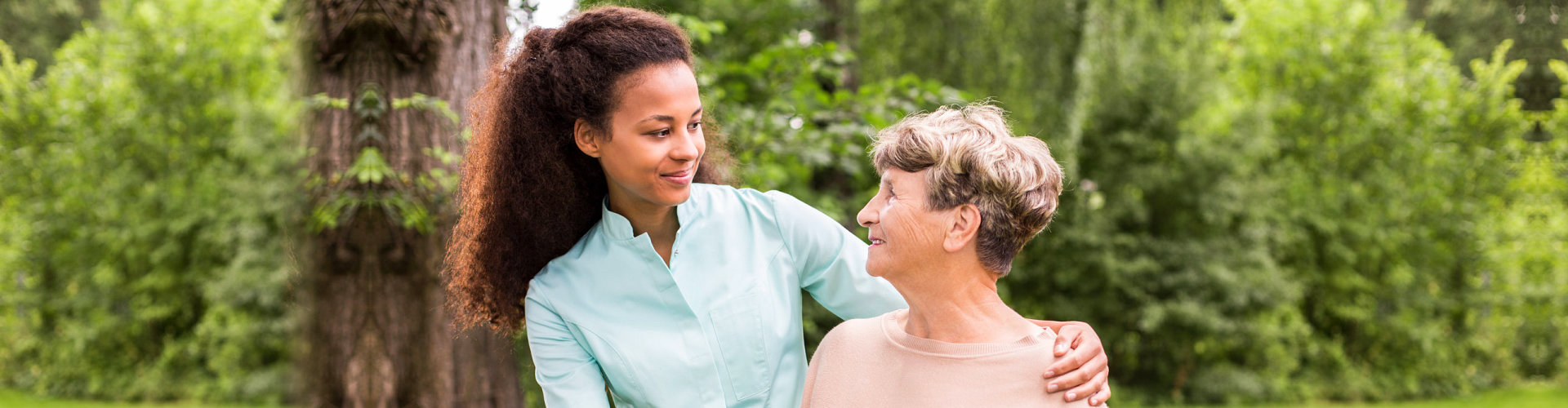 caregiver looking at the caregiver outdoors