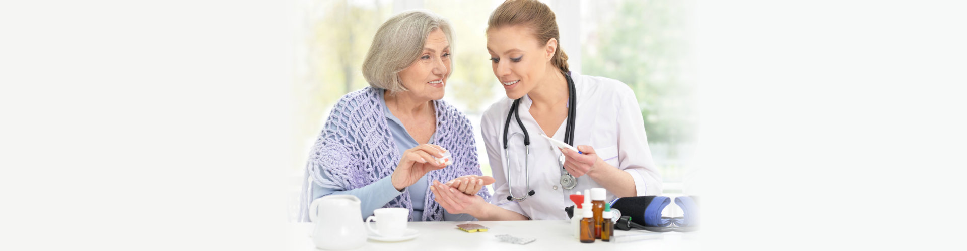 young doctor and her senior senior patient